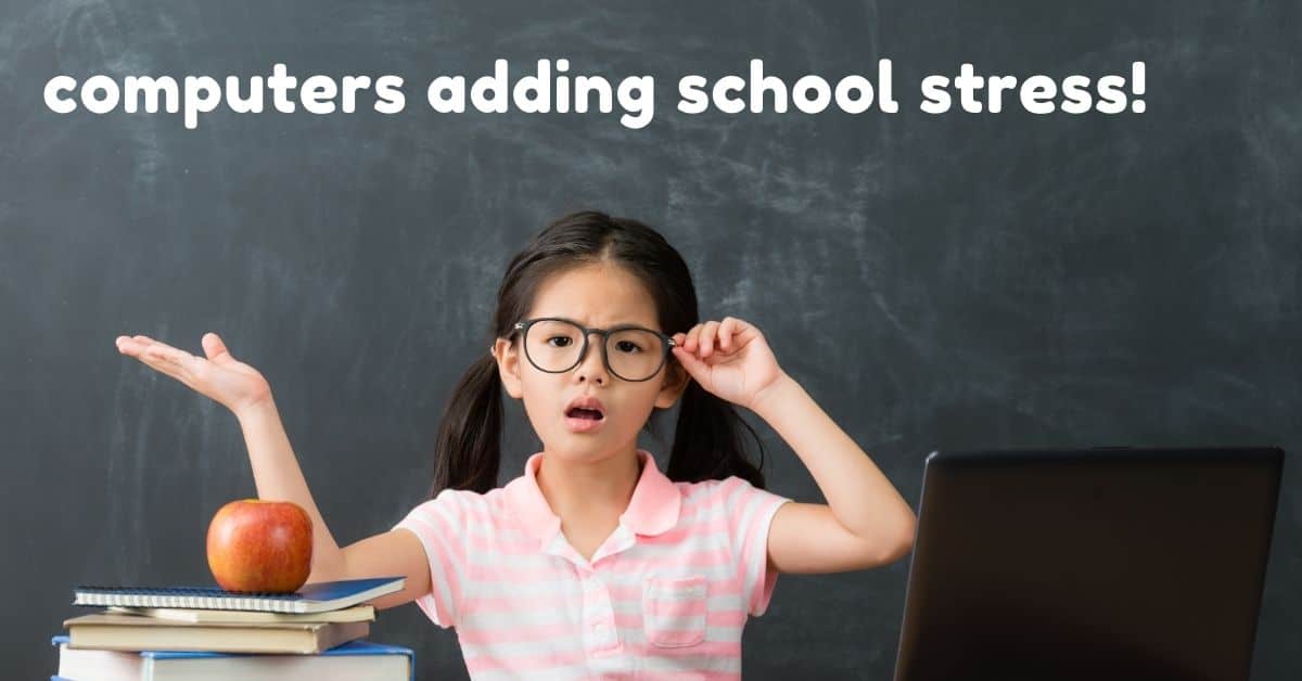computers adding school stress. girl with arms up and shrugging shoulders sits in front of a stack of books and a laptop