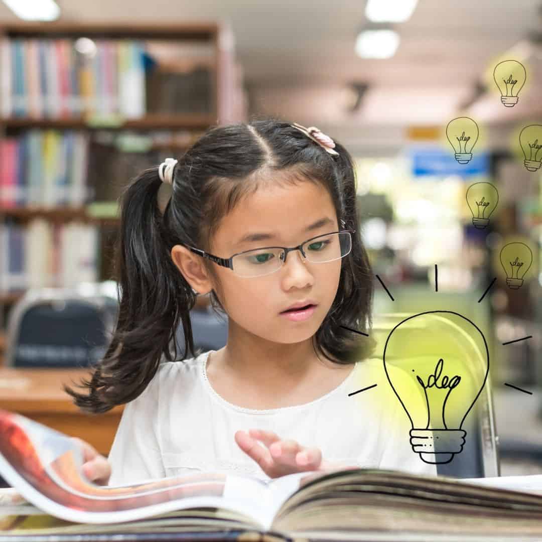 image of girl with glasses reading a book