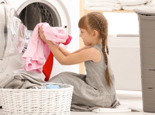 kid sorting laundry